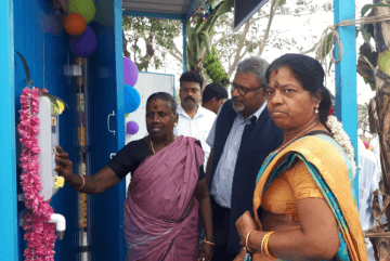 village-women-opening-water-atm