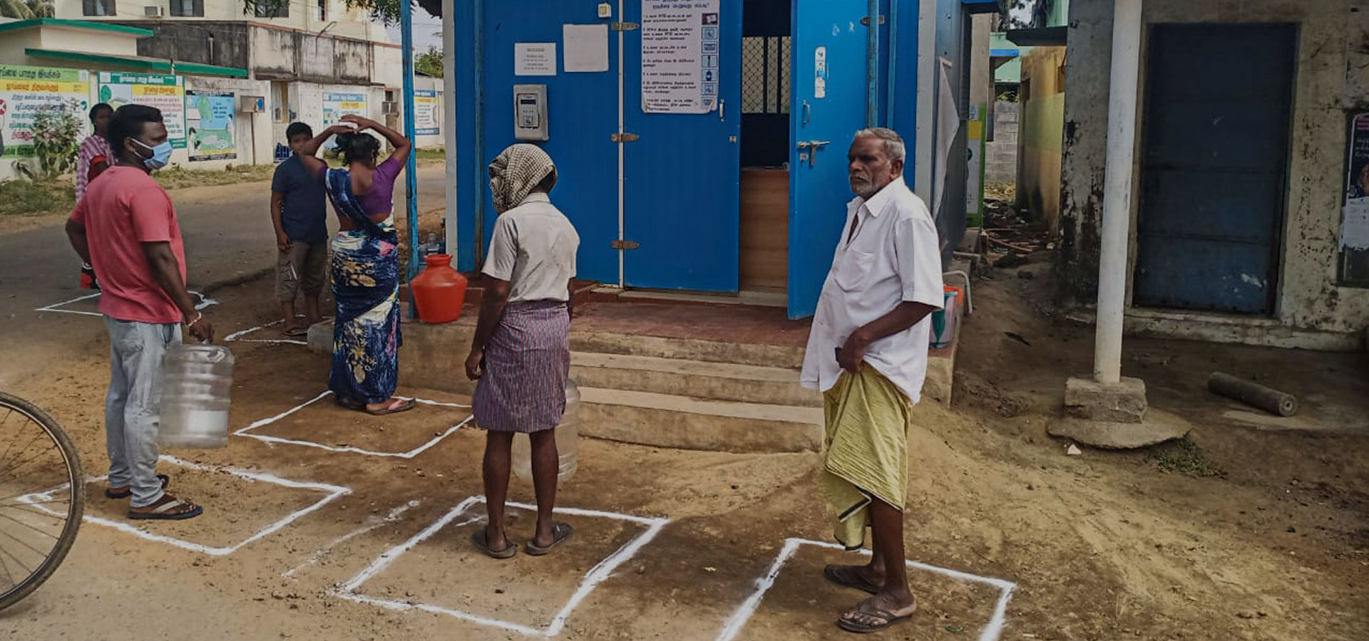 In COVID 19 - maintaining Social Distancing while standing in queue for filling water from Piramal Sarvajal water atm